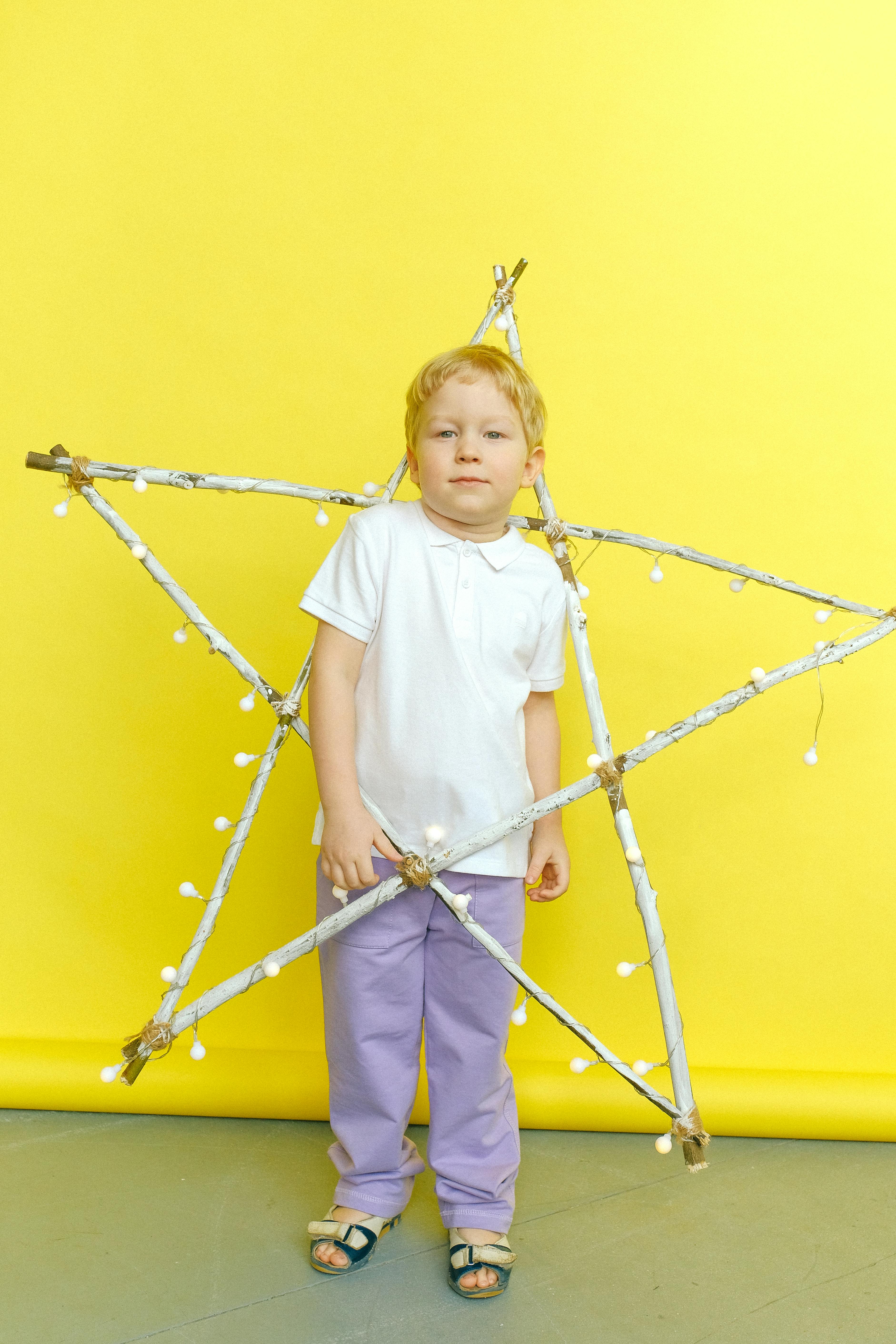 A child holding a decorative star